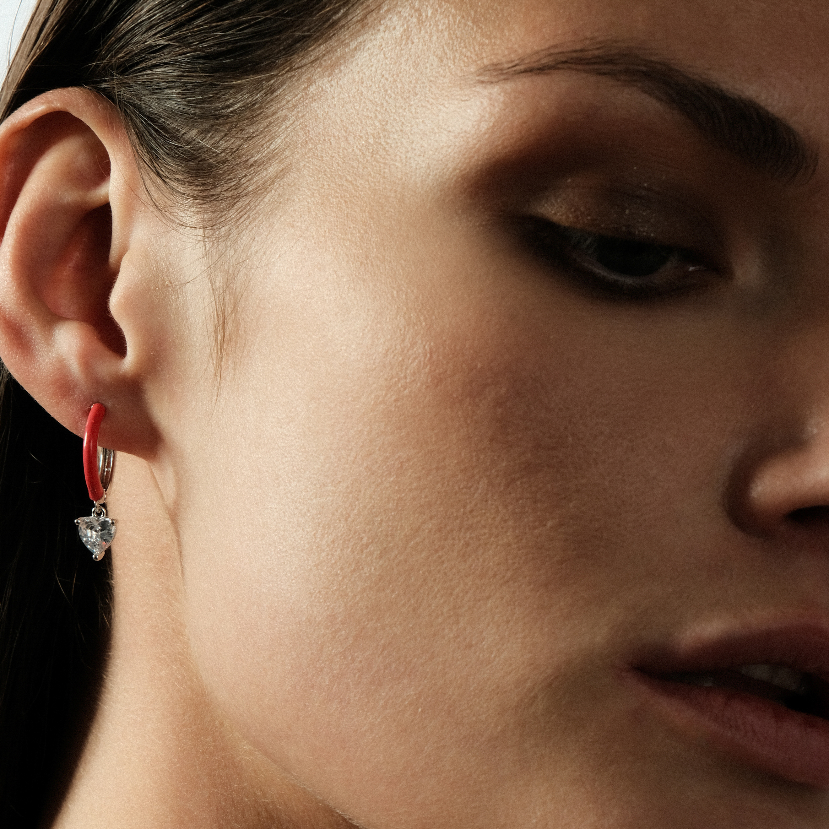 enamel earrings with a heart-cut pendant