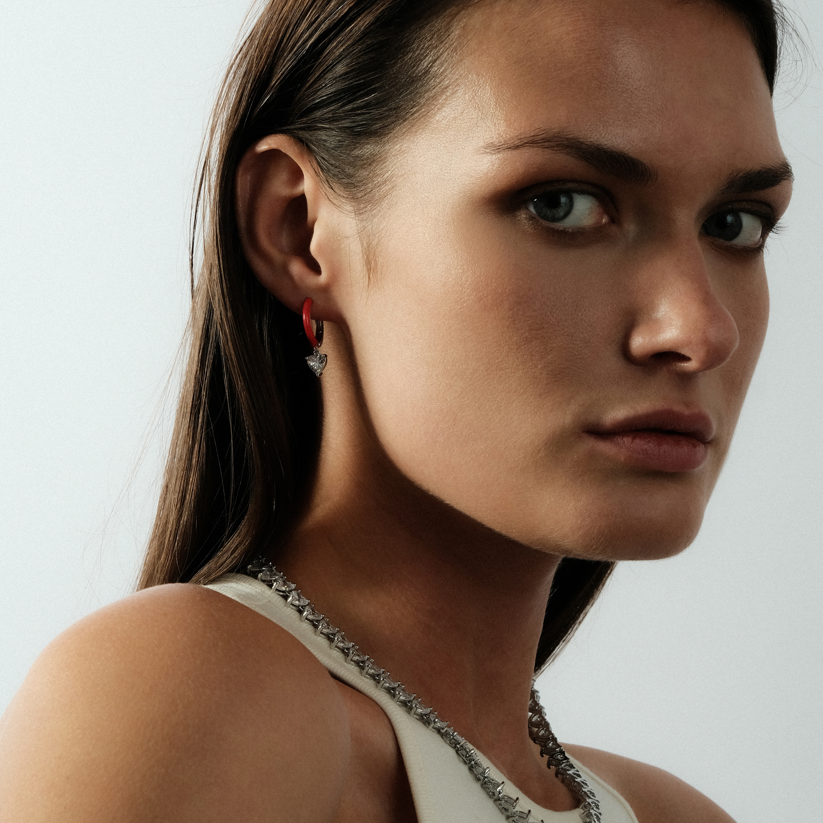 enamel earrings with a heart-cut pendant