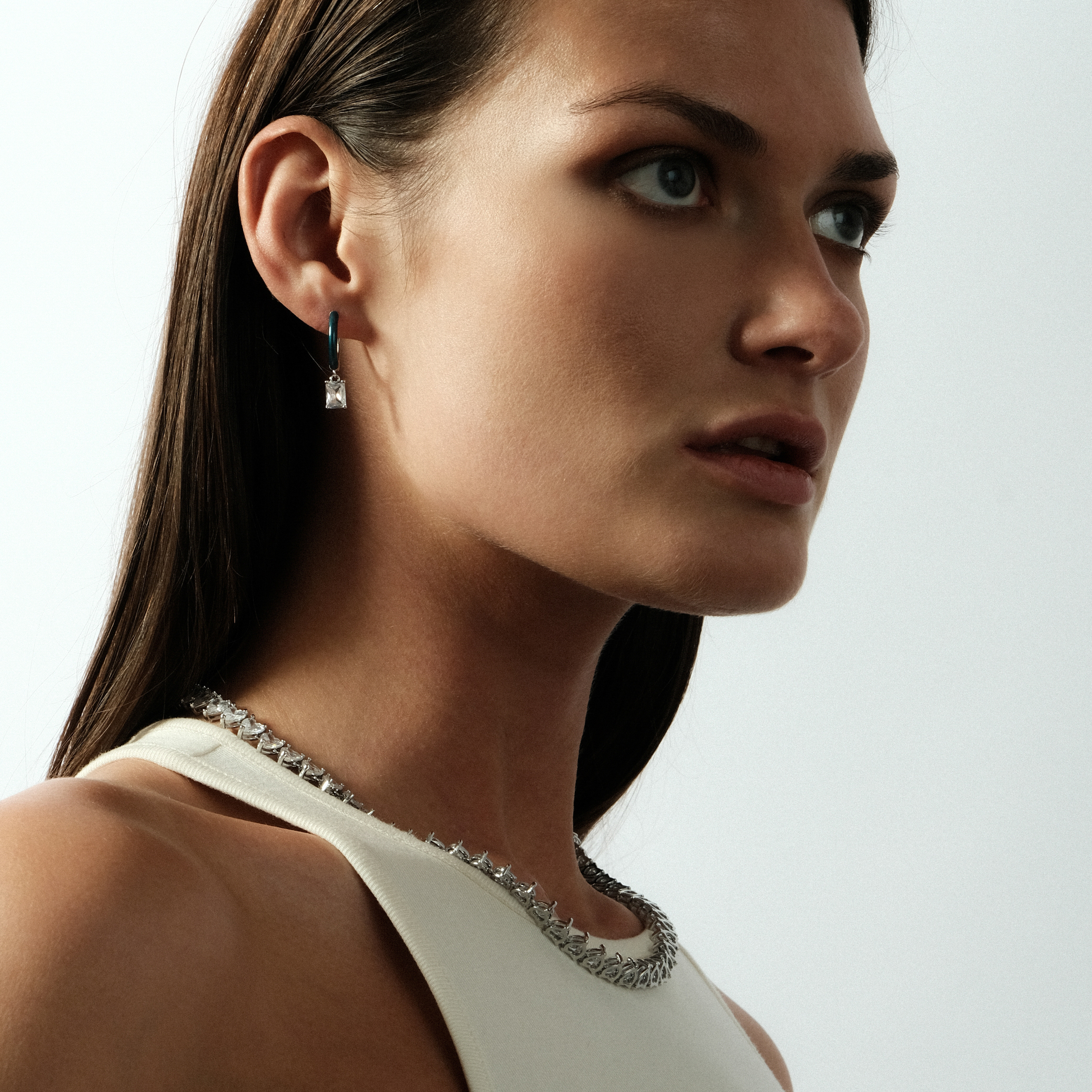 enamel earrings with a baguette cut pendant