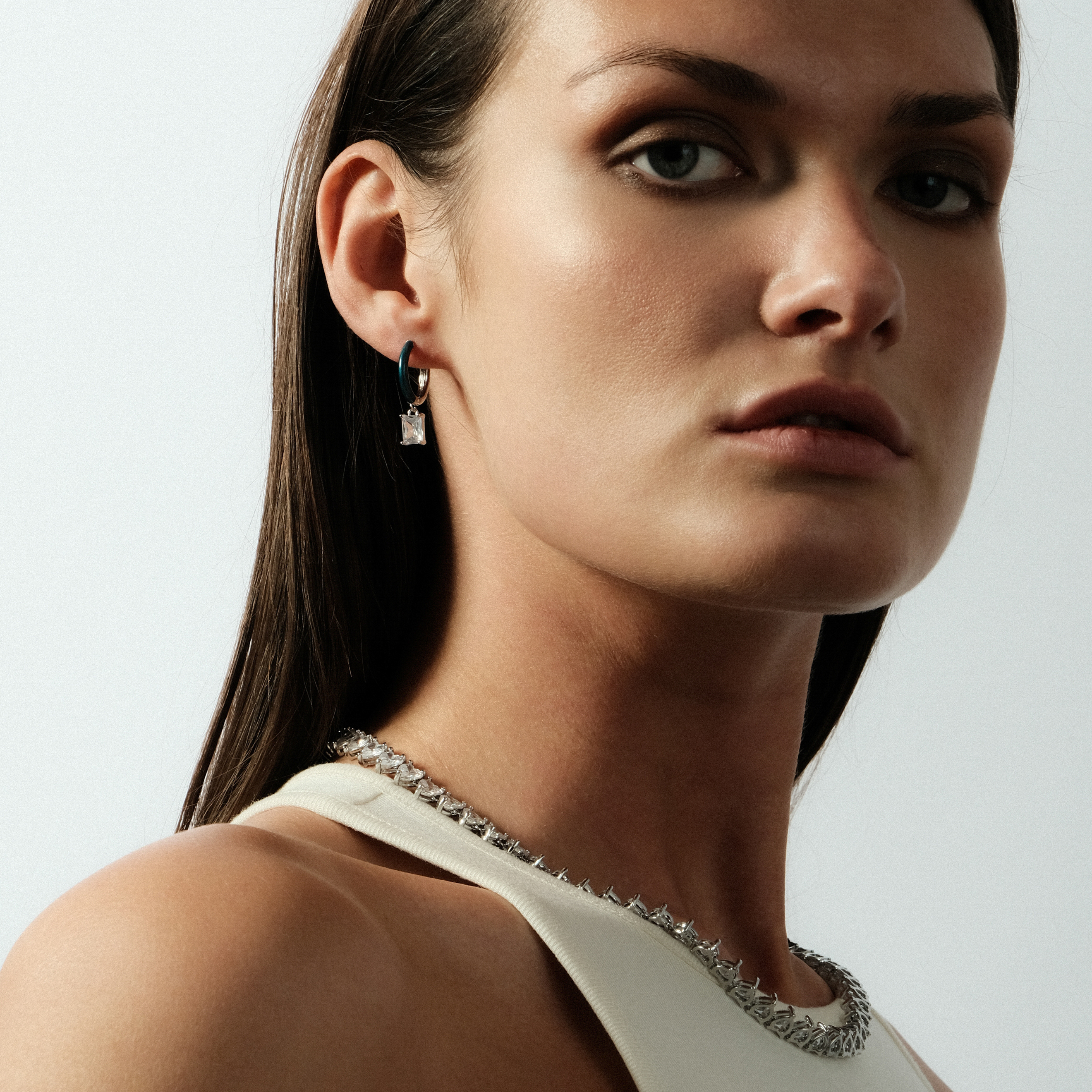 enamel earrings with a baguette cut pendant