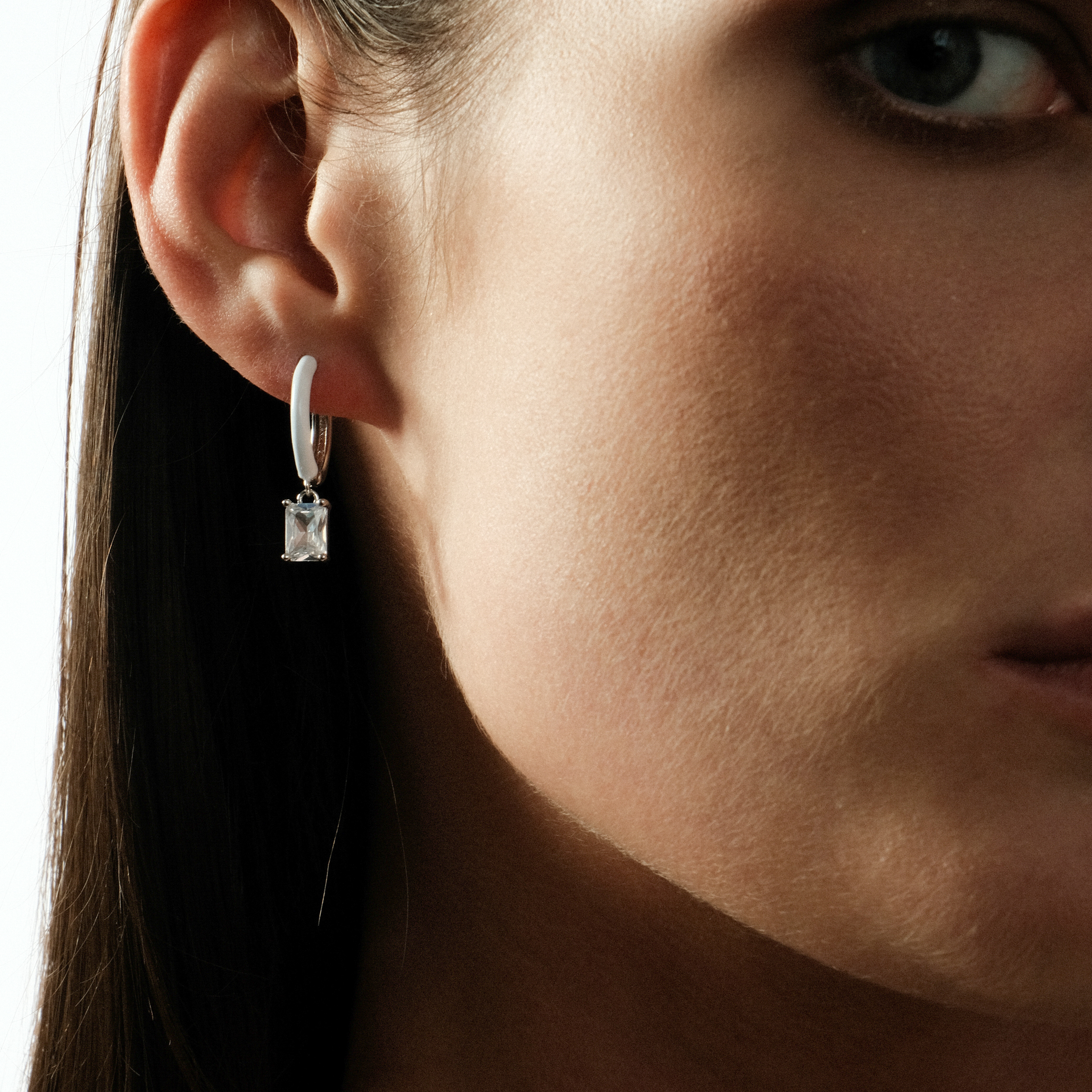 enamel earrings with a baguette cut pendant