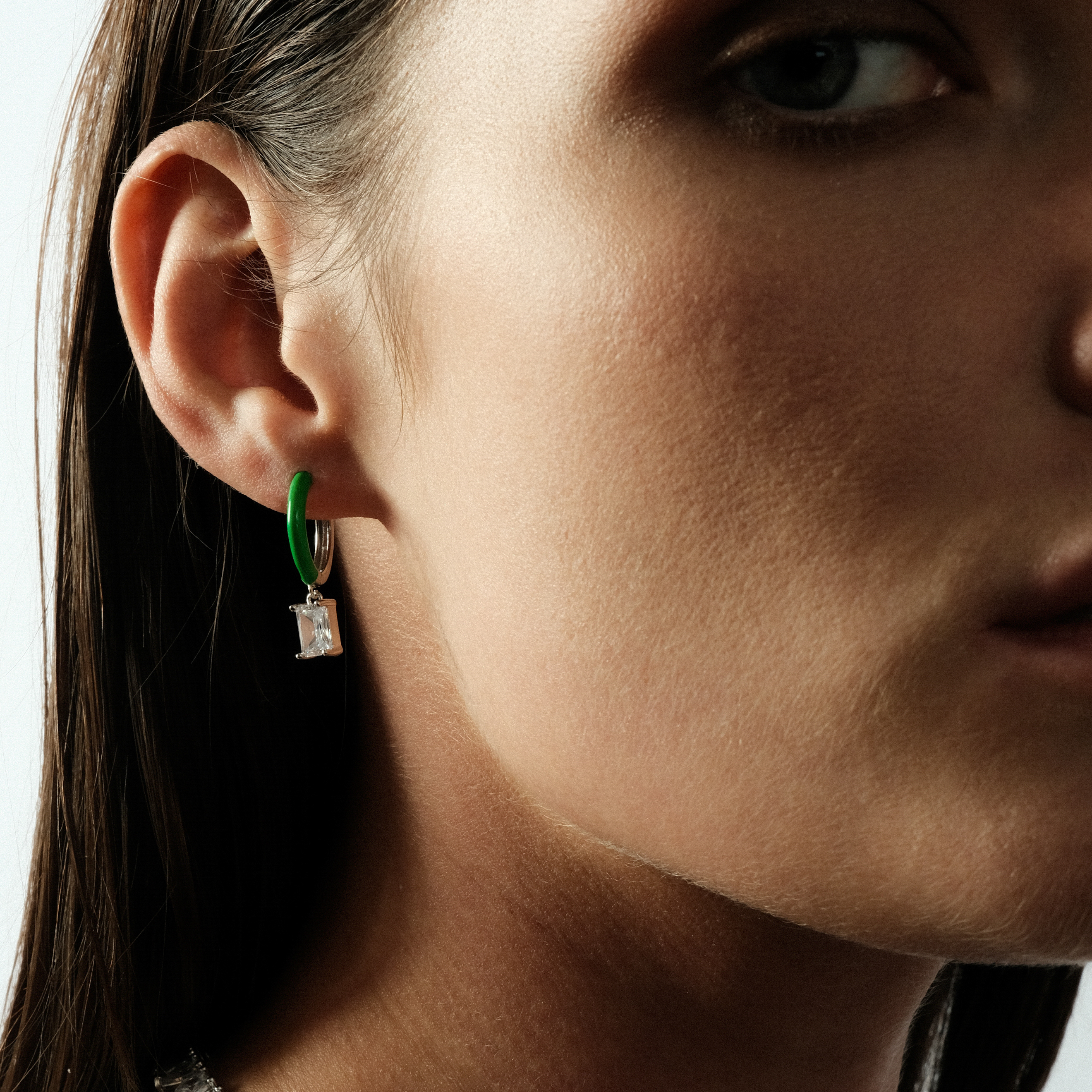enamel earrings with a baguette cut pendant