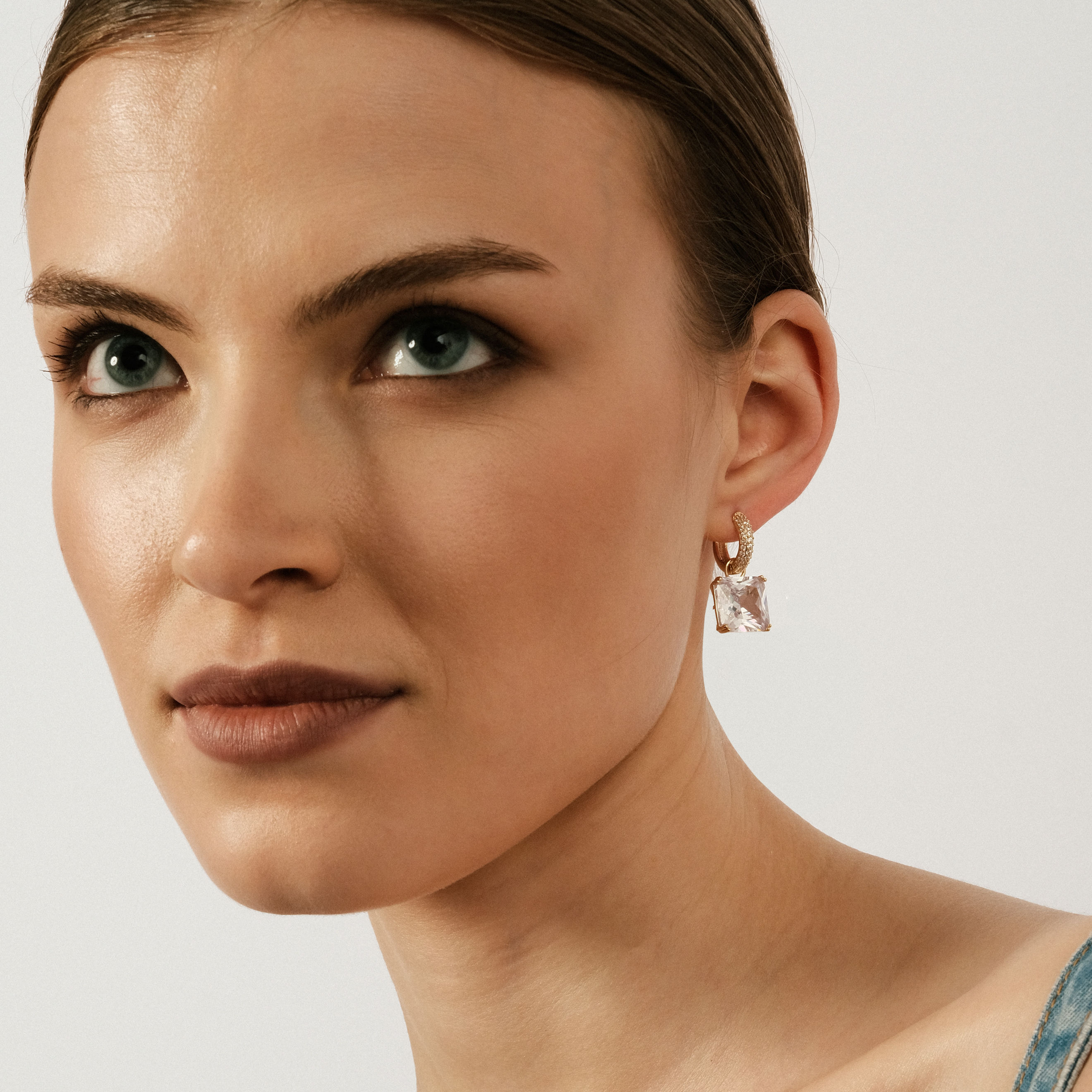 gold-tone earrings with a crystal