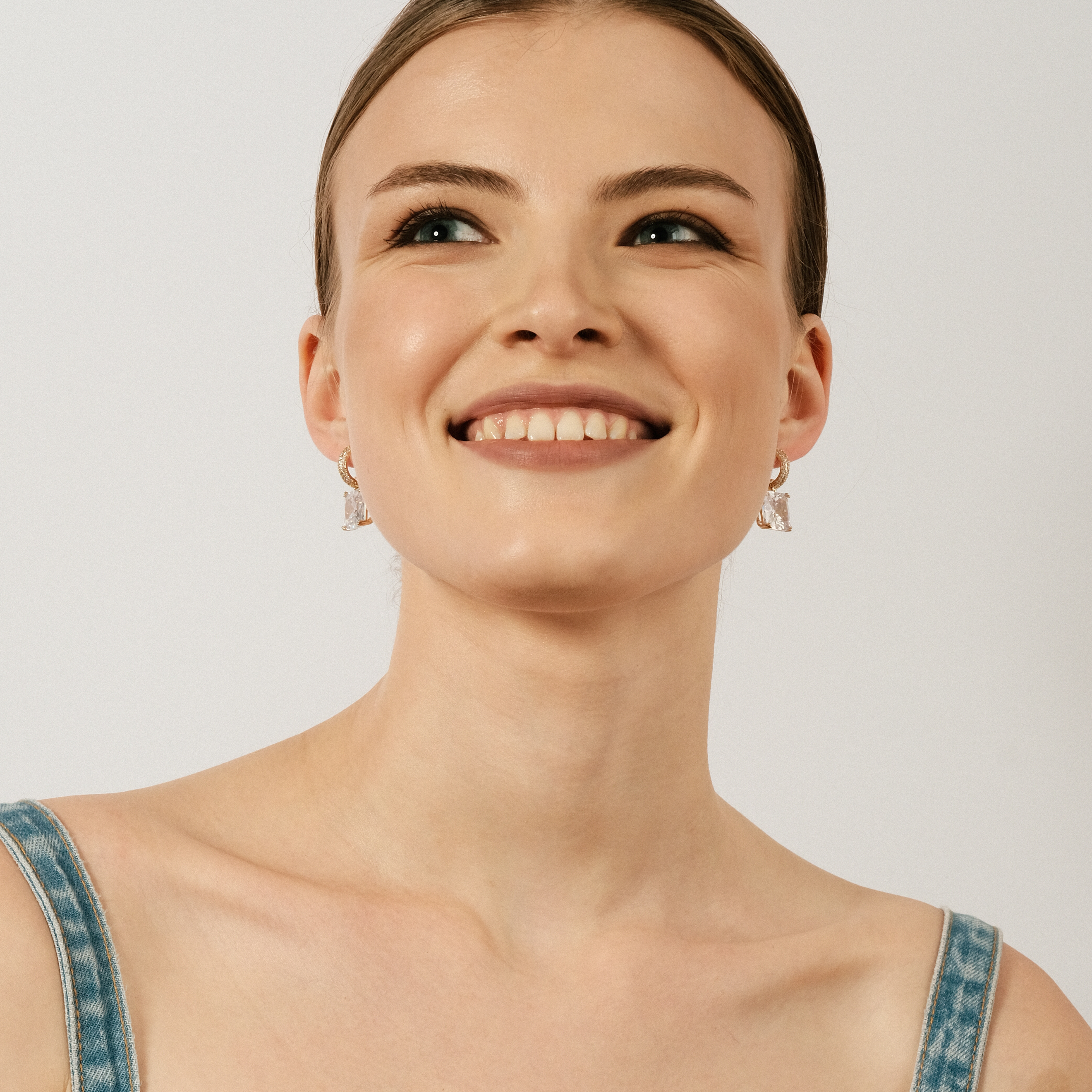 gold-tone earrings with a crystal