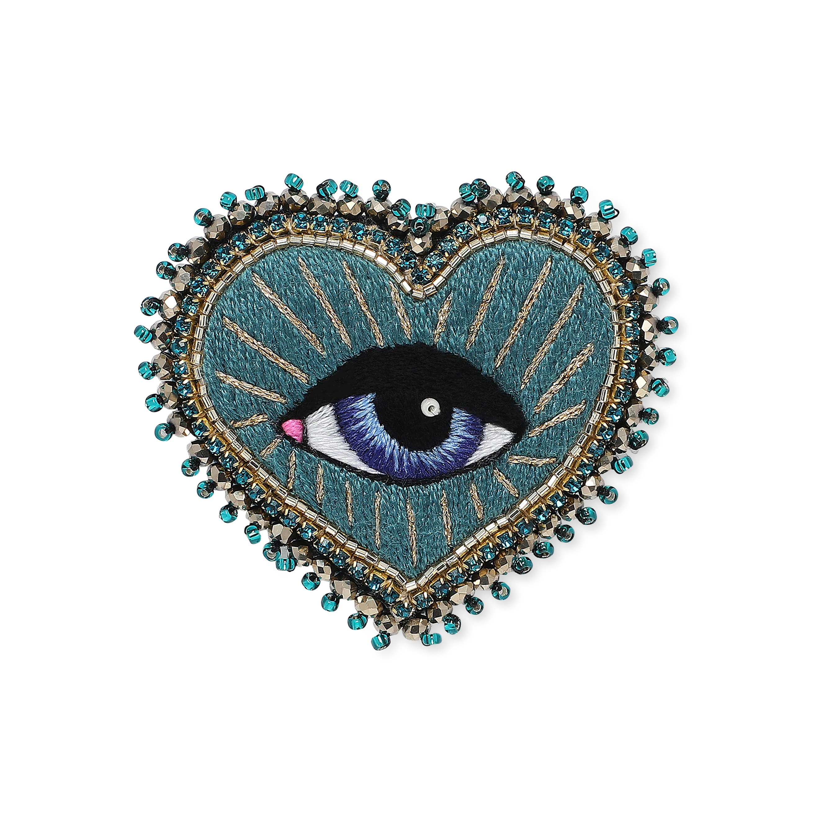 Heart brooch with an eye on a green background