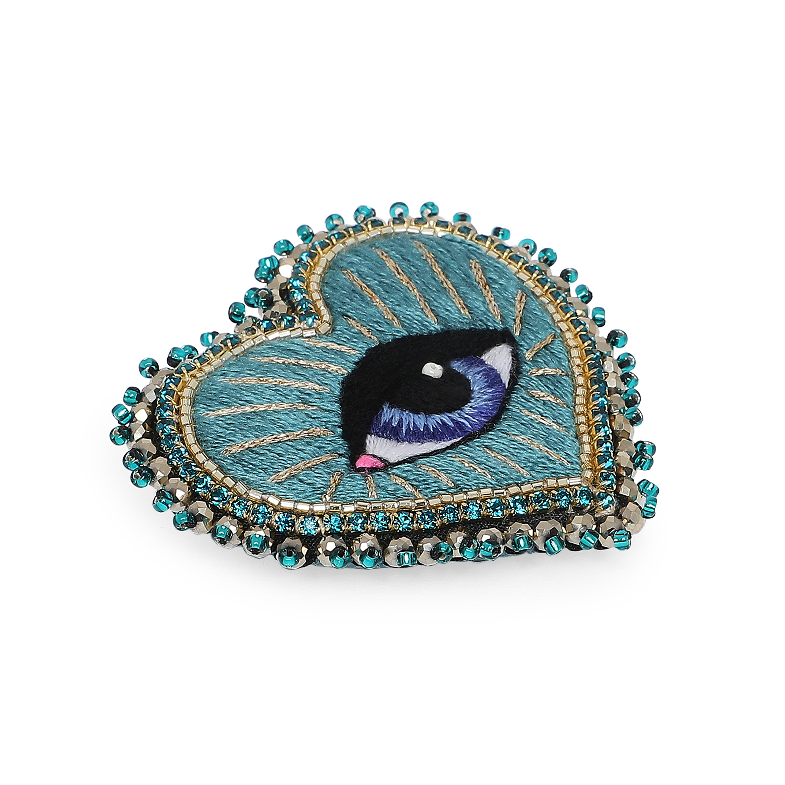 Heart brooch with an eye on a green background