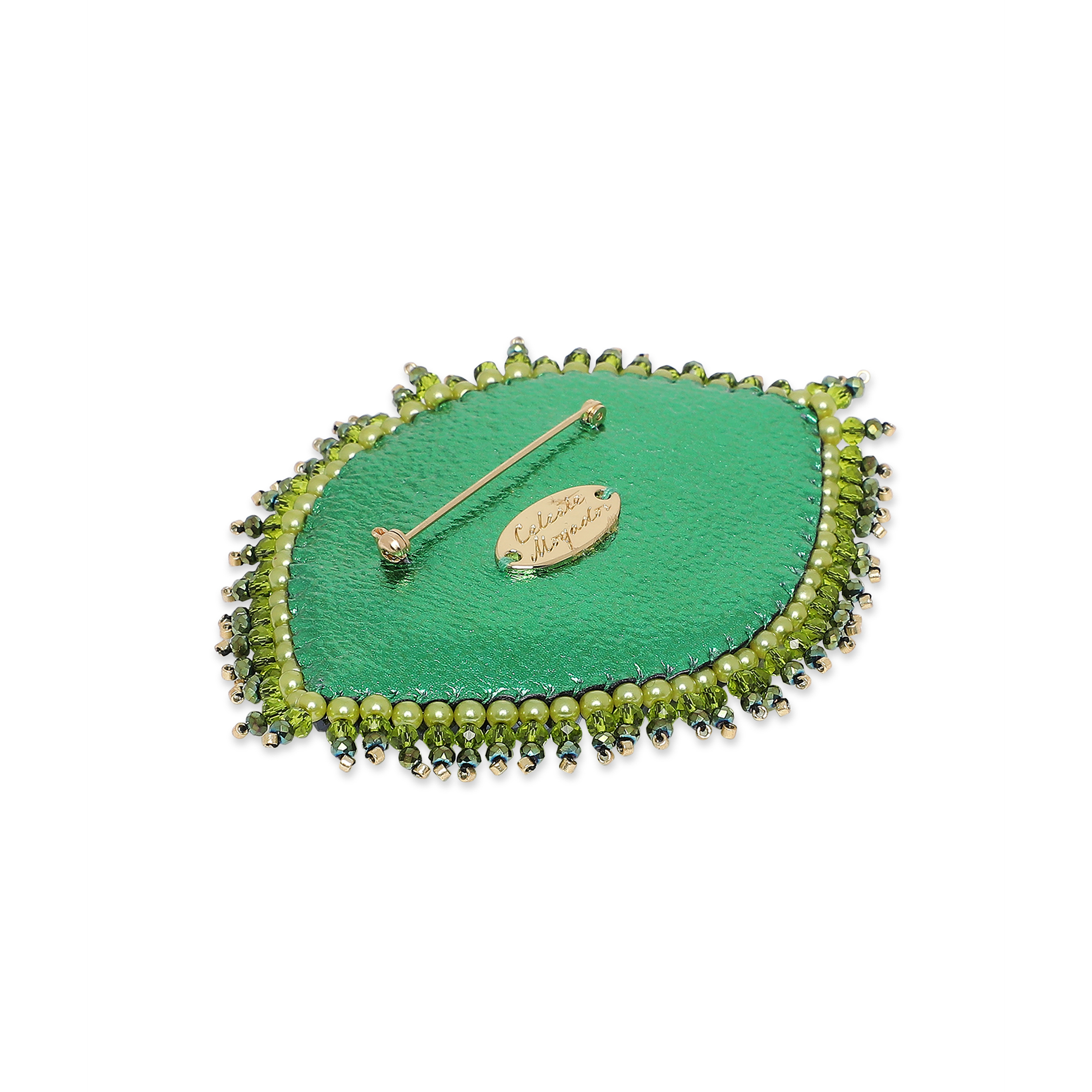 large green eye brooch with crystals
