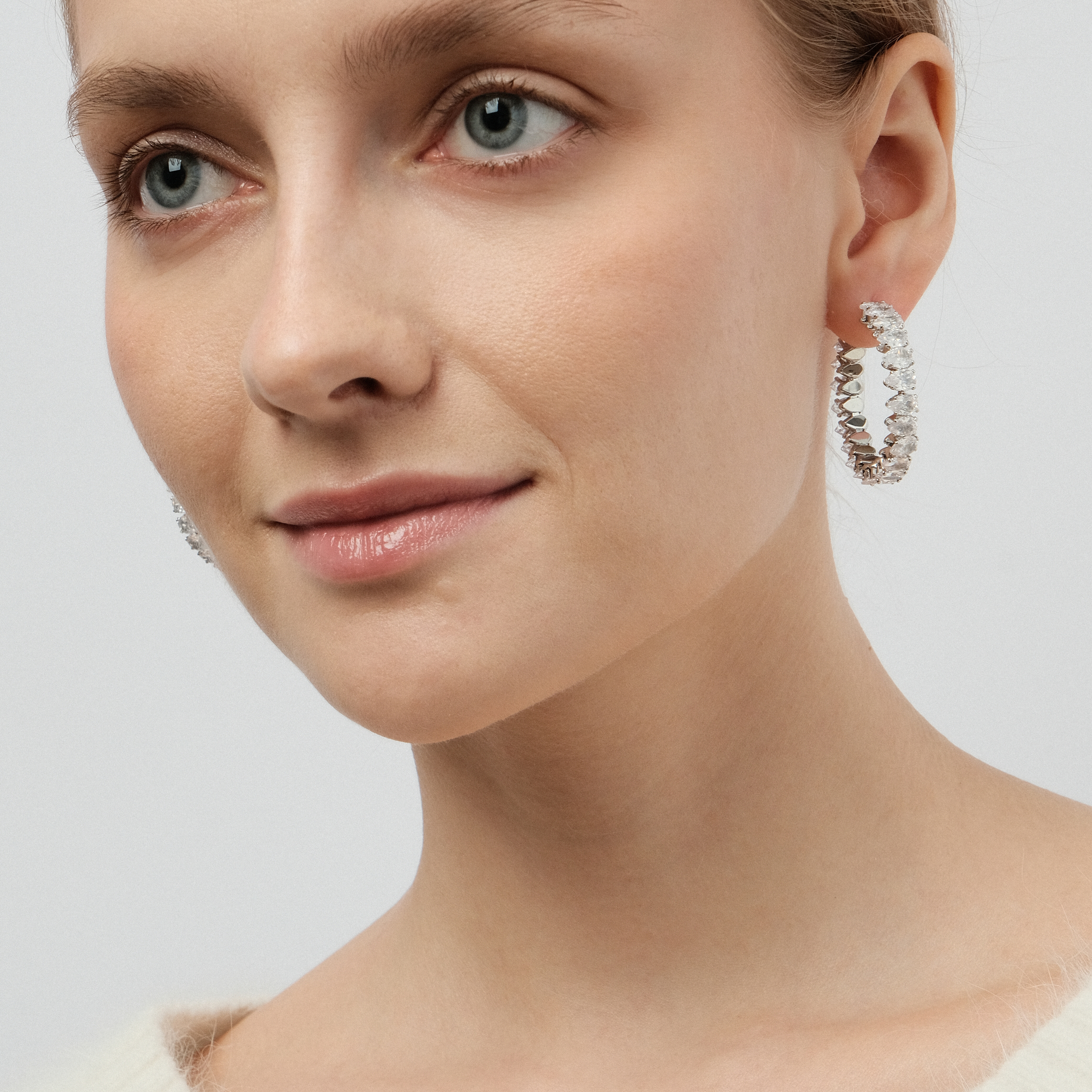 round earrings with crystals