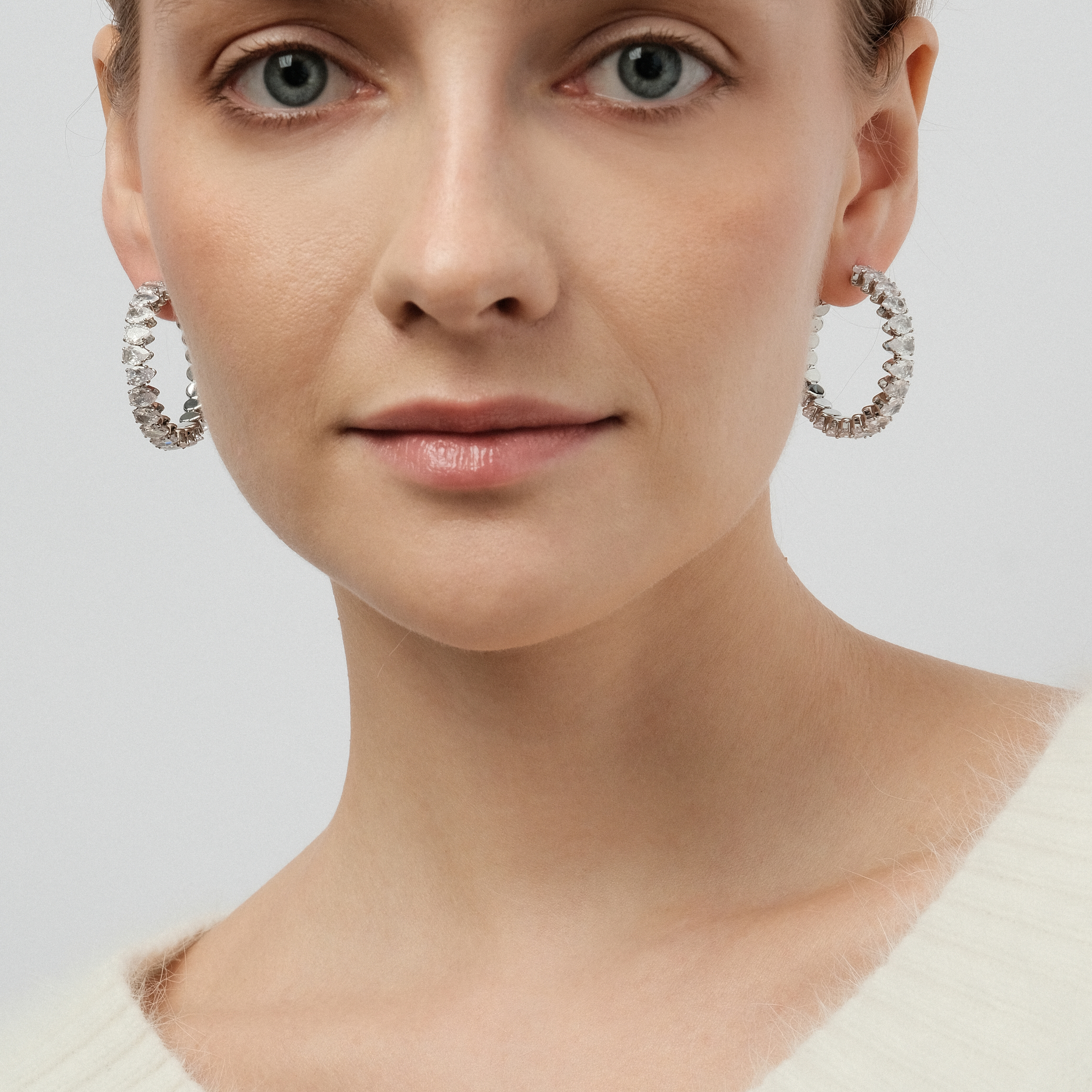 round earrings with crystals