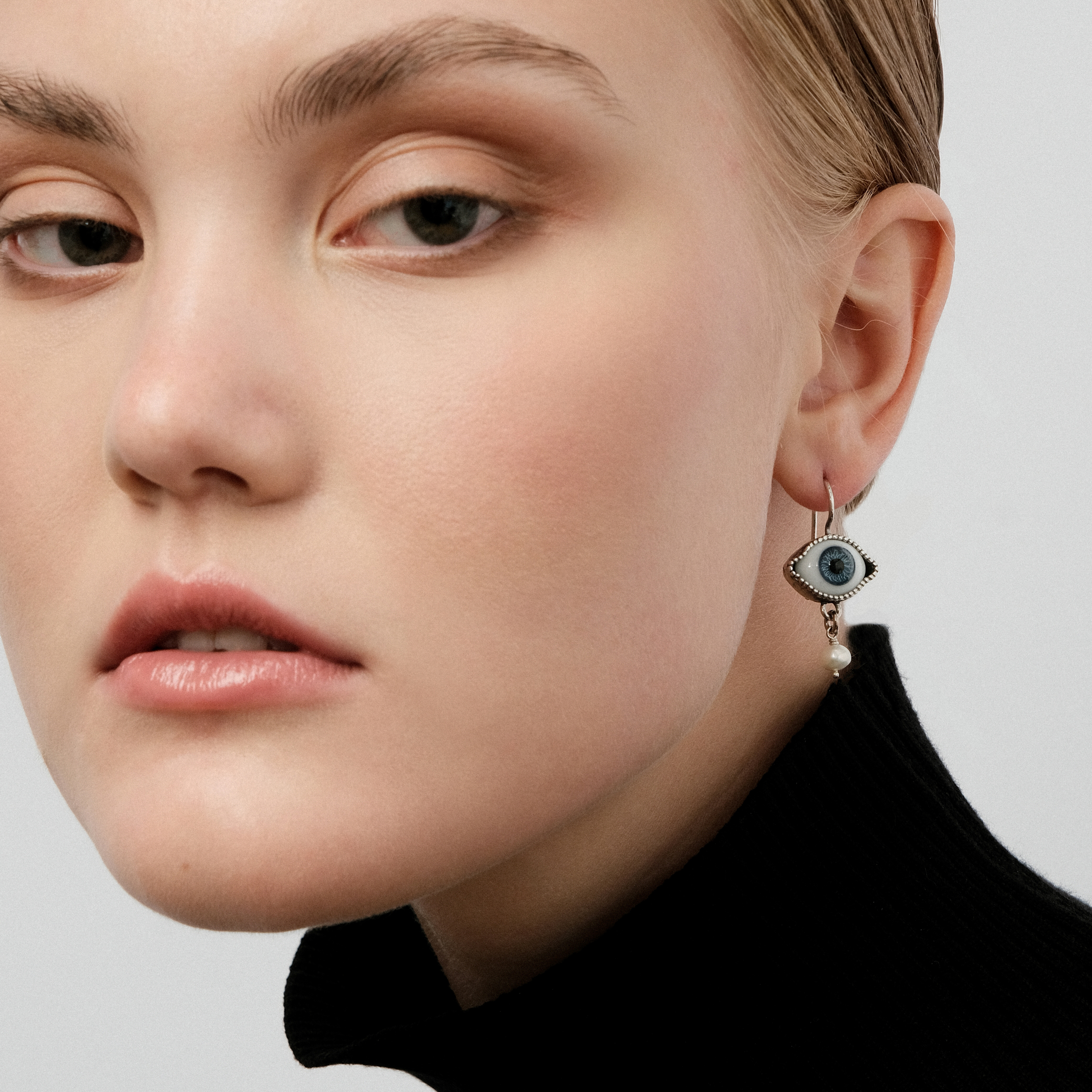 silver blue eye earrings with pearl pendants