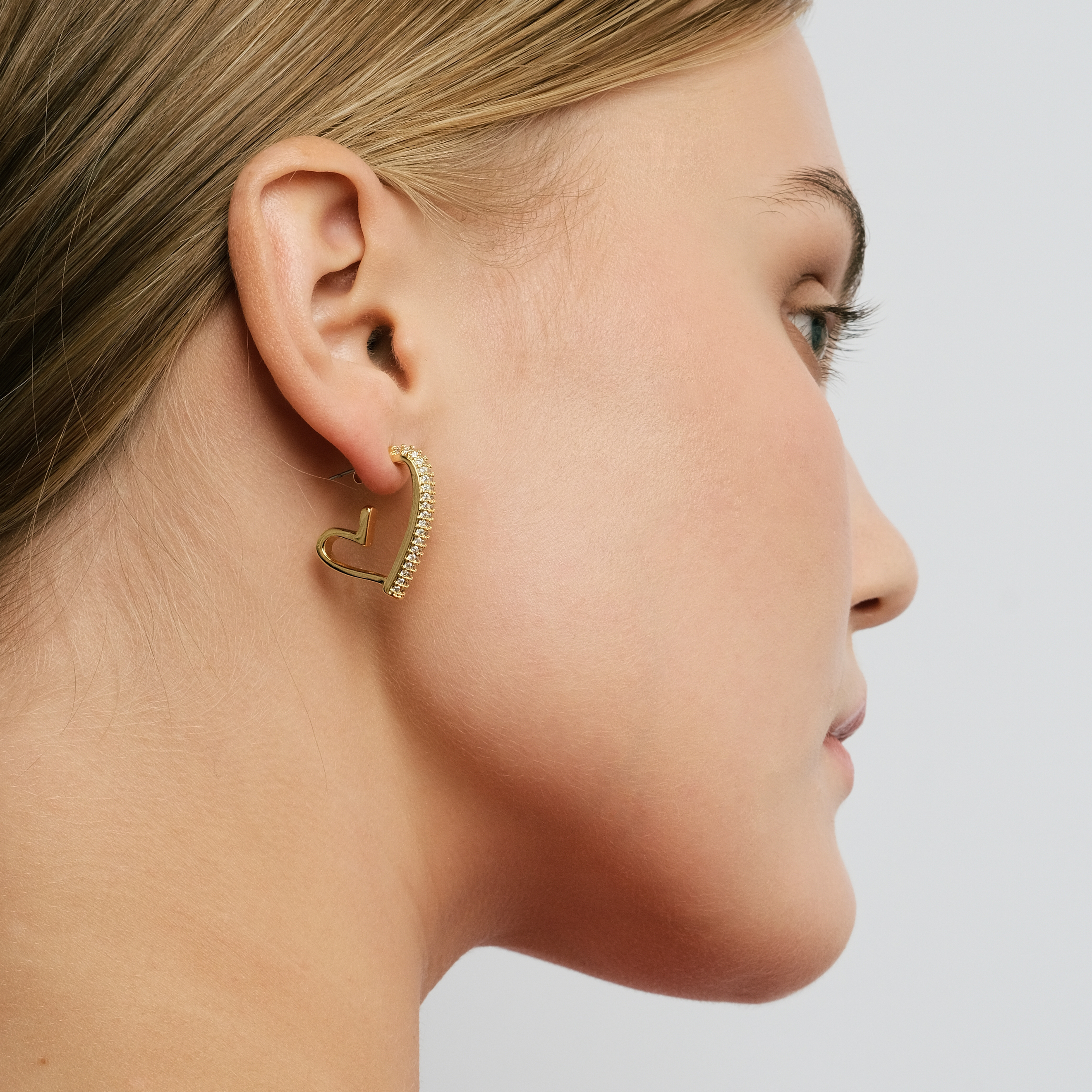 Golden heart earrings with pavé