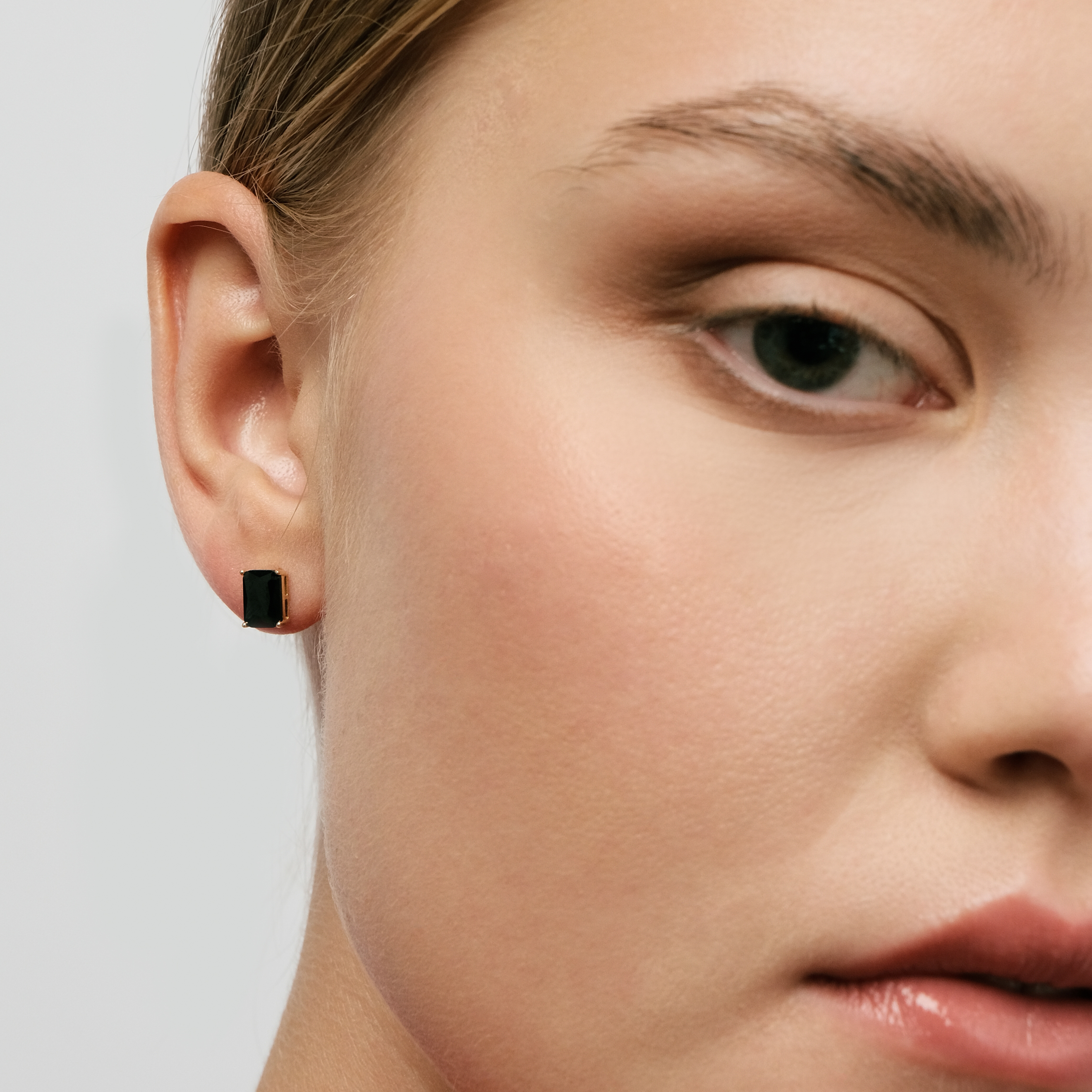 Golden earrings with black square crystal