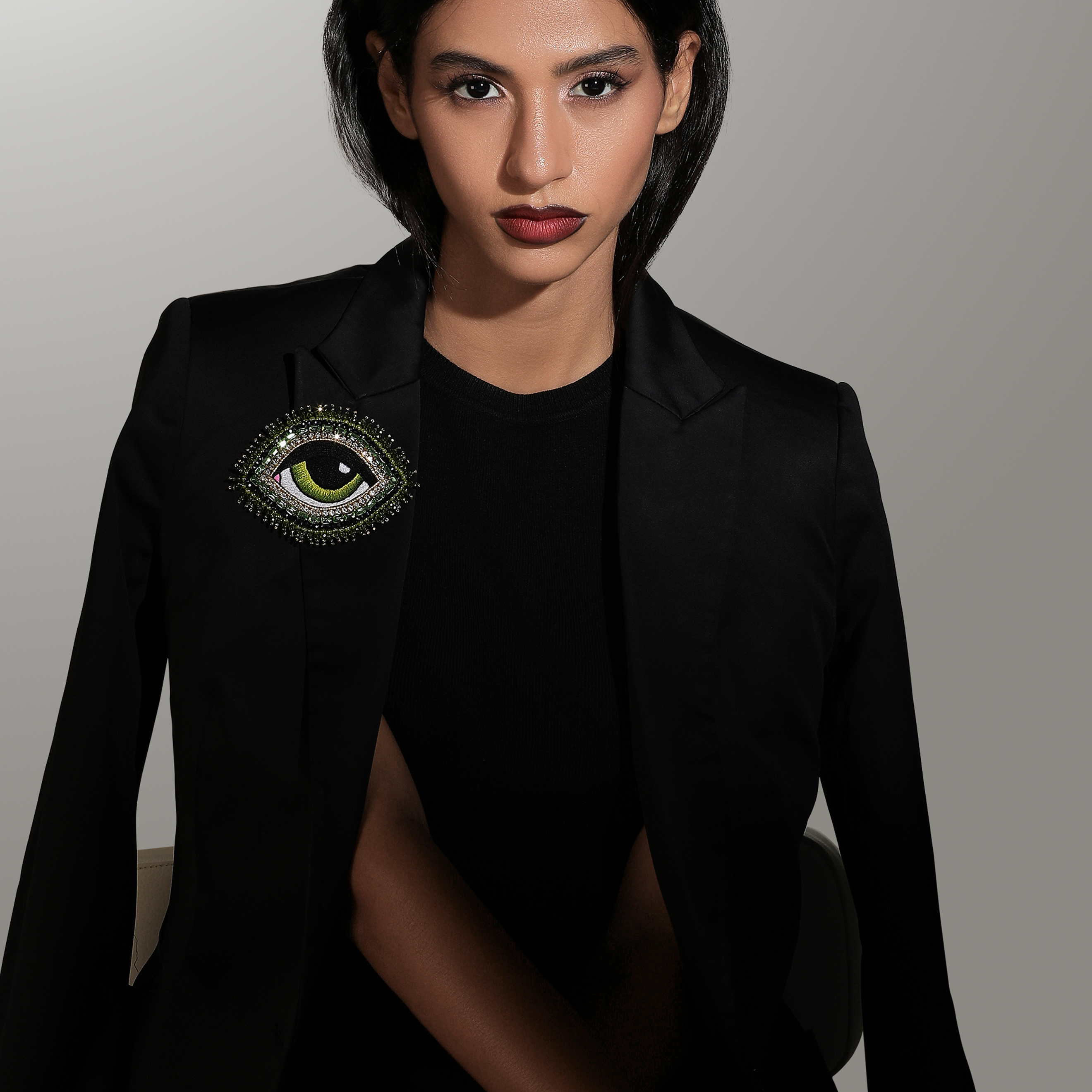 large green eye brooch with crystals