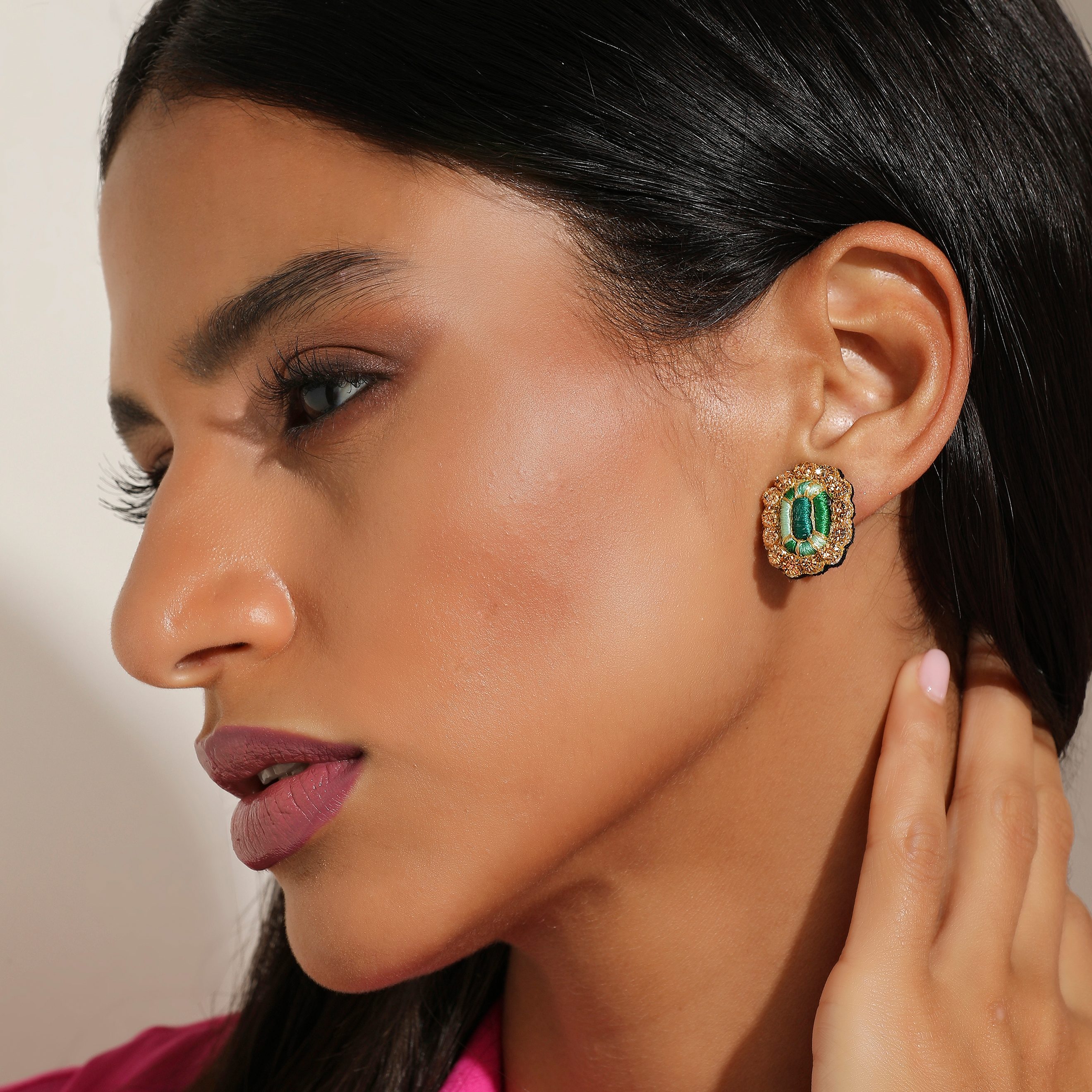 Small clips with embroidered emeralds