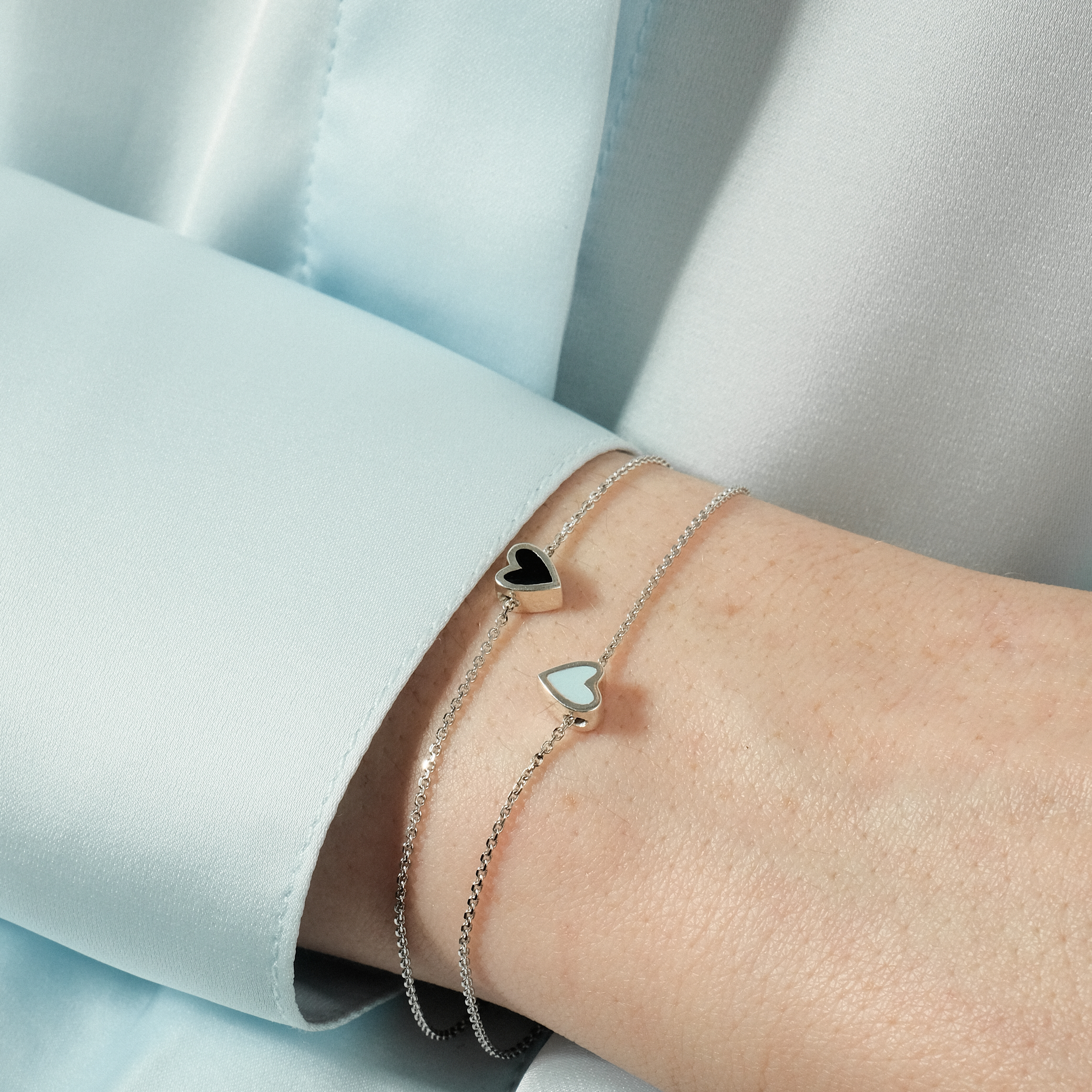 Silver bracelet with a blue heart
