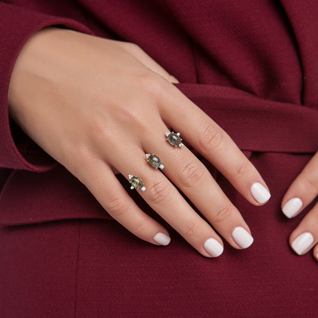 Silver two-finger ring with green tourmalines