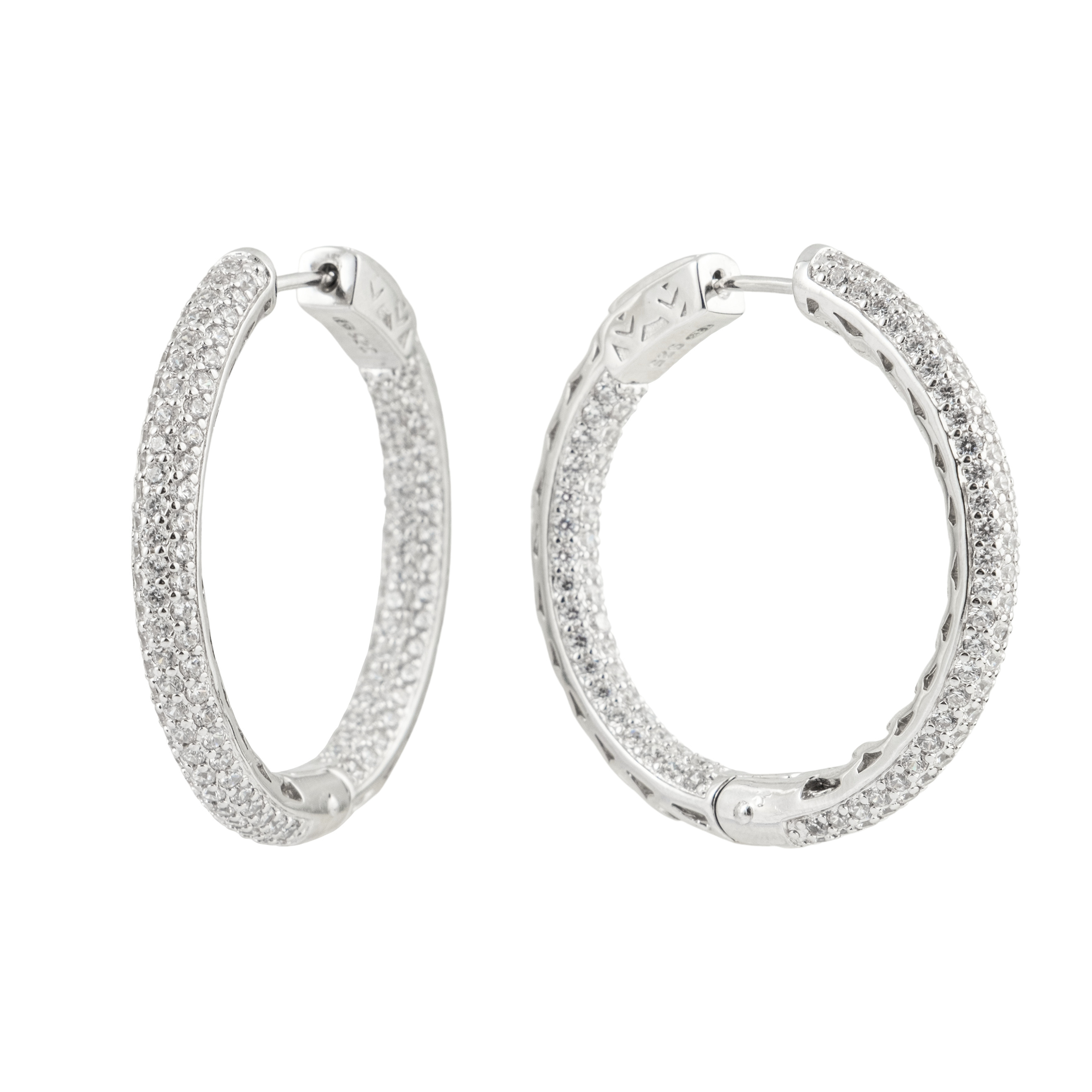 Large silver hoop earrings with white crystals