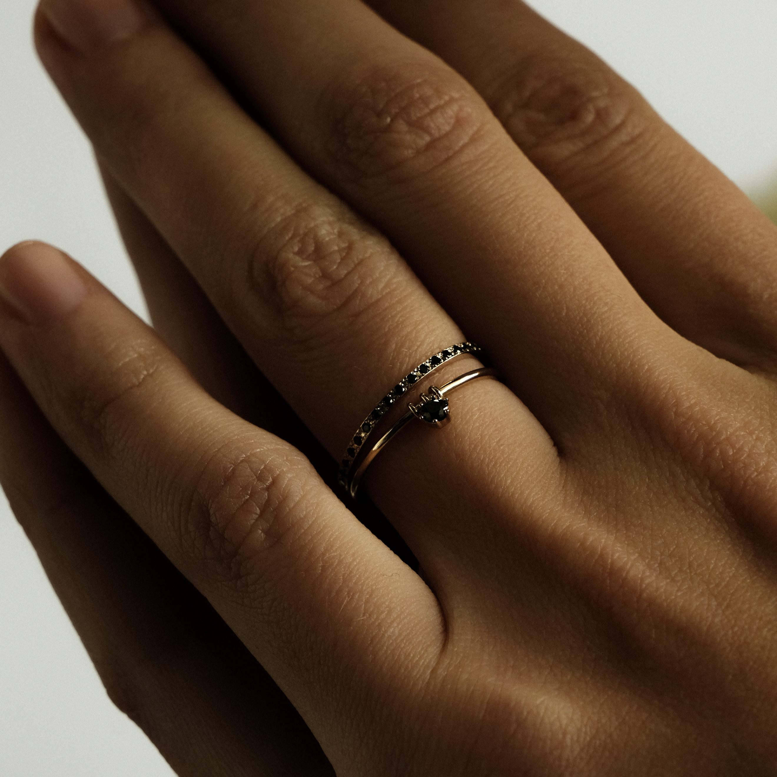 Black gold ring with movable element
