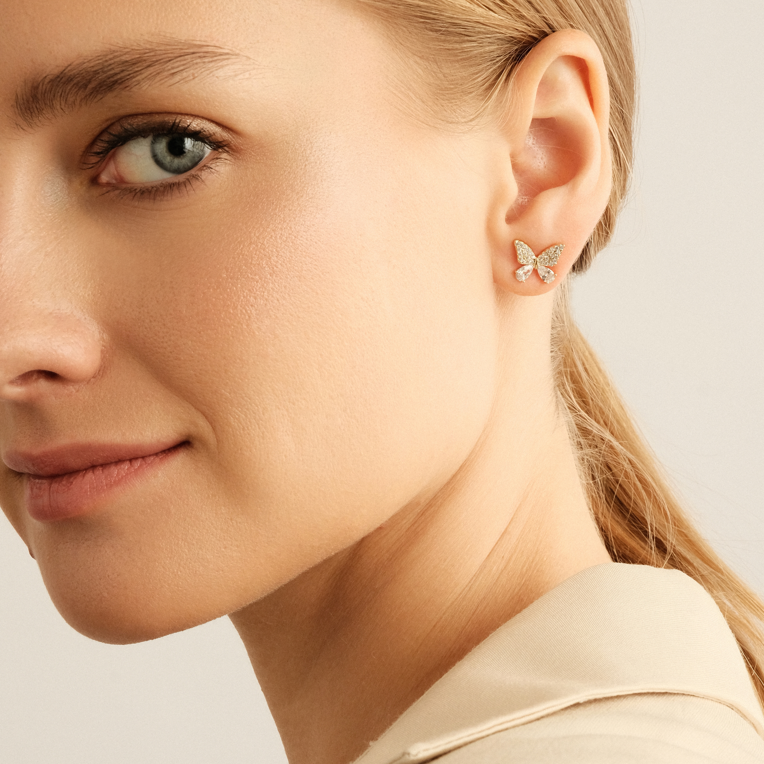 Golden stud earrings with butterflies