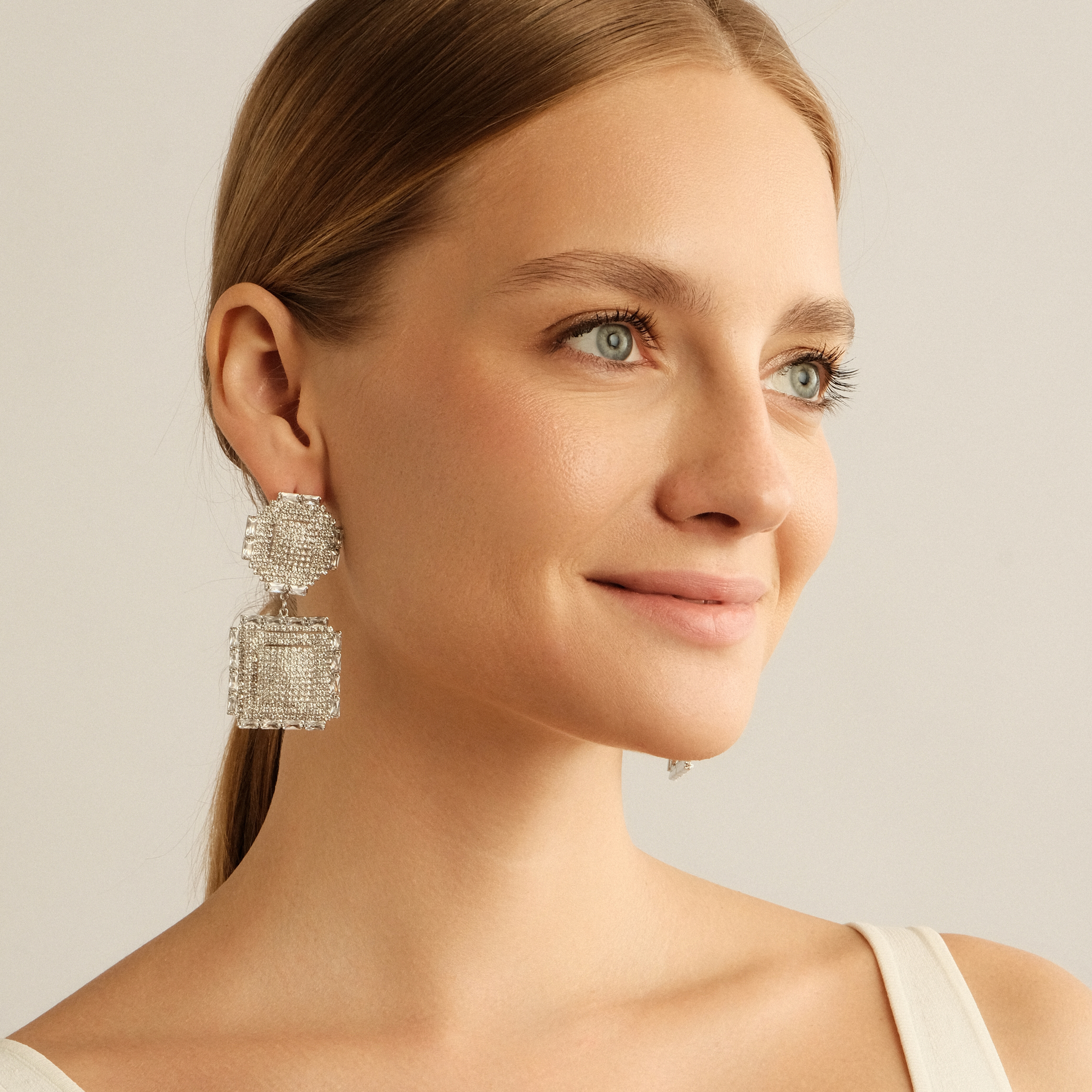 Double silver earrings completely covered with crystals