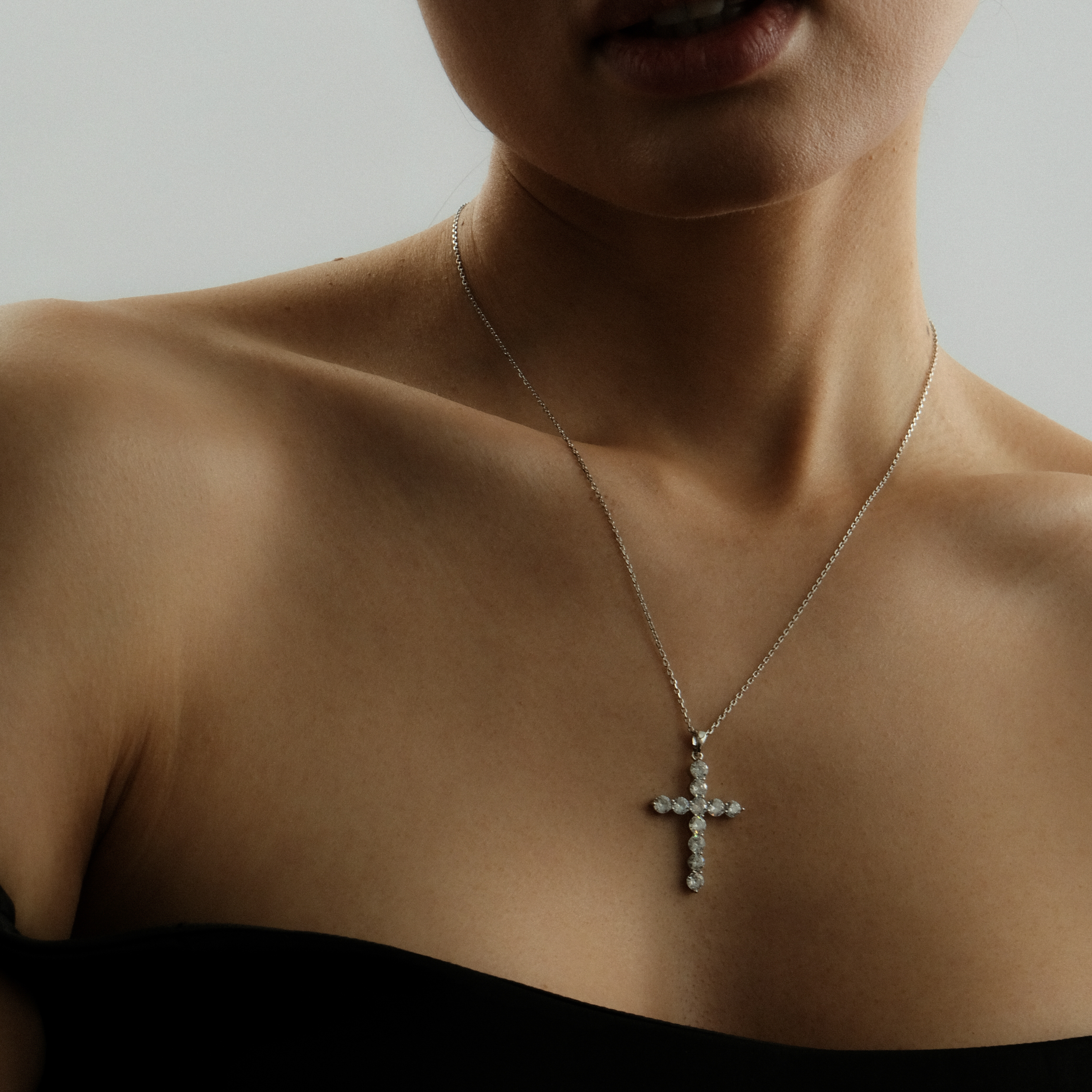 Silver chain with a large crystal cross
